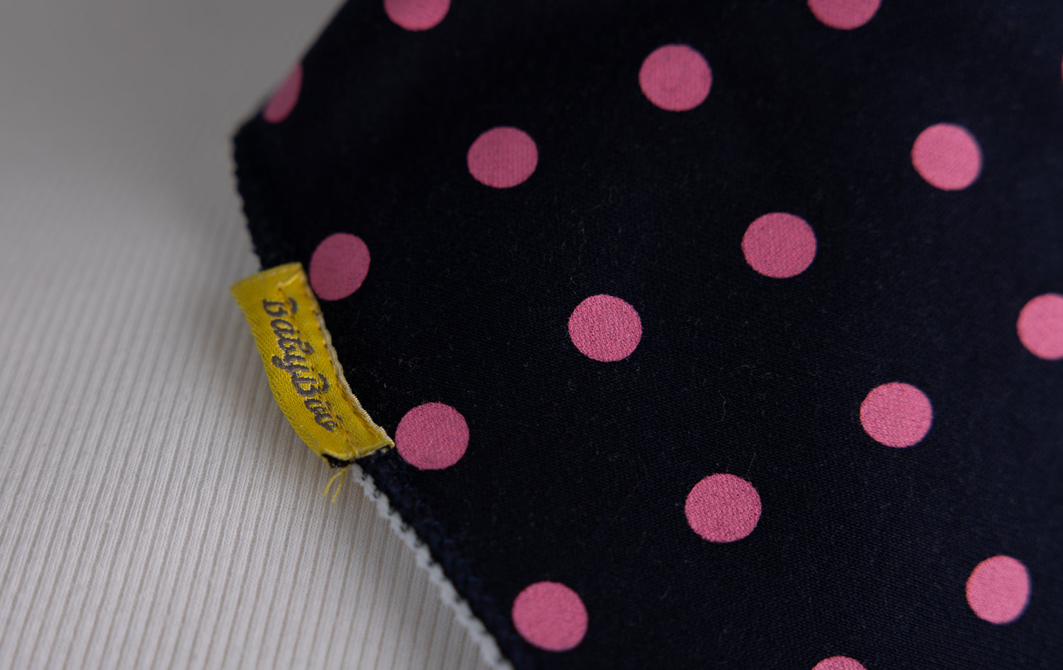 Navy with pink polka organic cotton DribbleBoo bandana bib