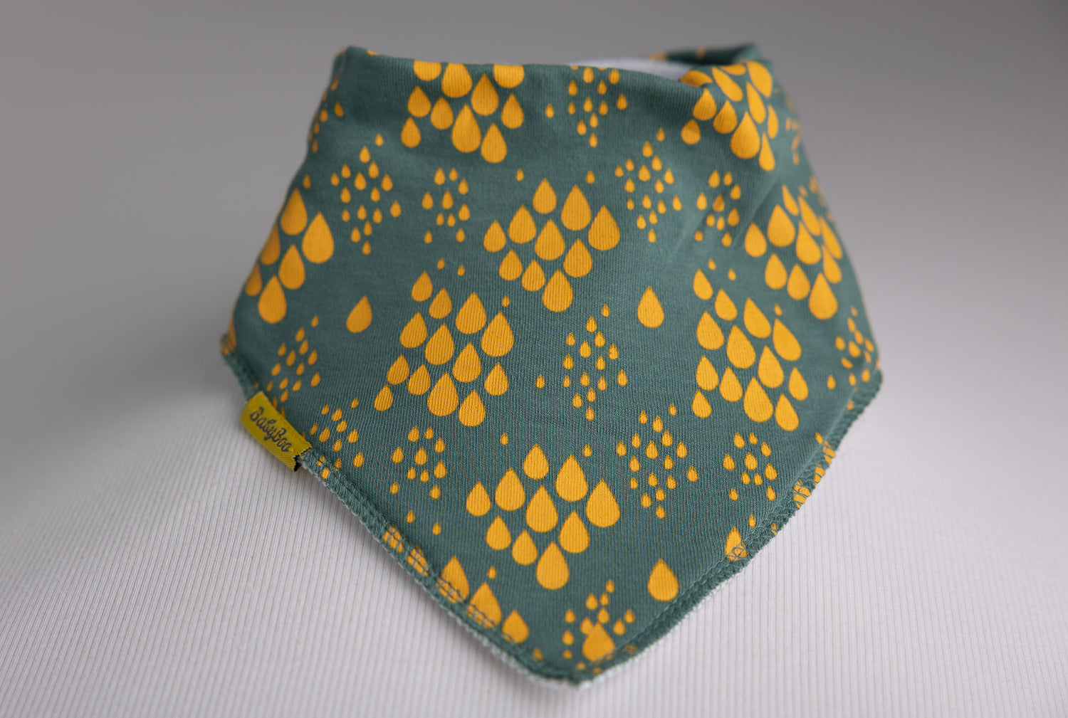 Teal with mustard raindrops organic cotton DribbleBoo bandana bib