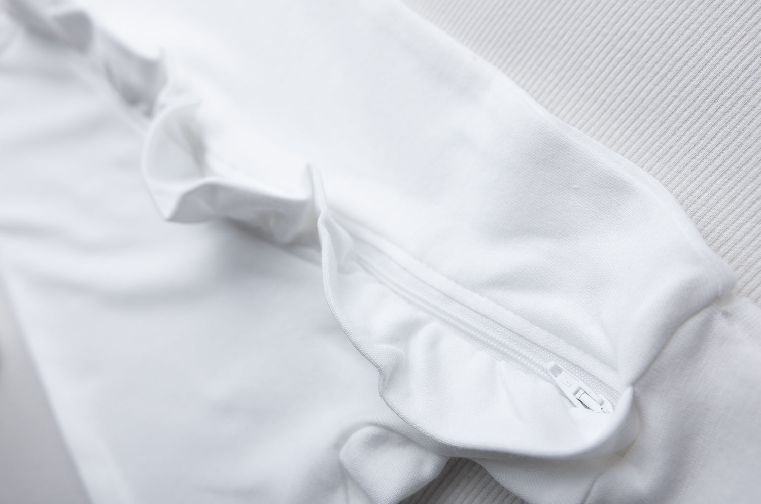 White ruffle organic cotton ZippyBoo suit