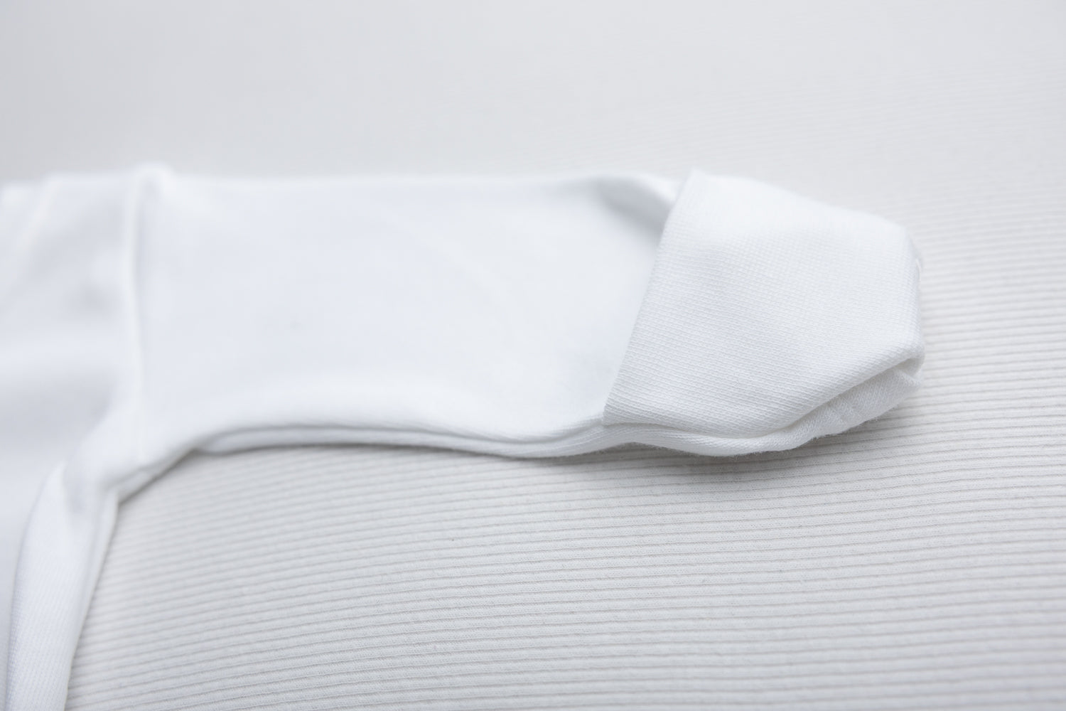 White ruffle organic cotton ZippyBoo suit