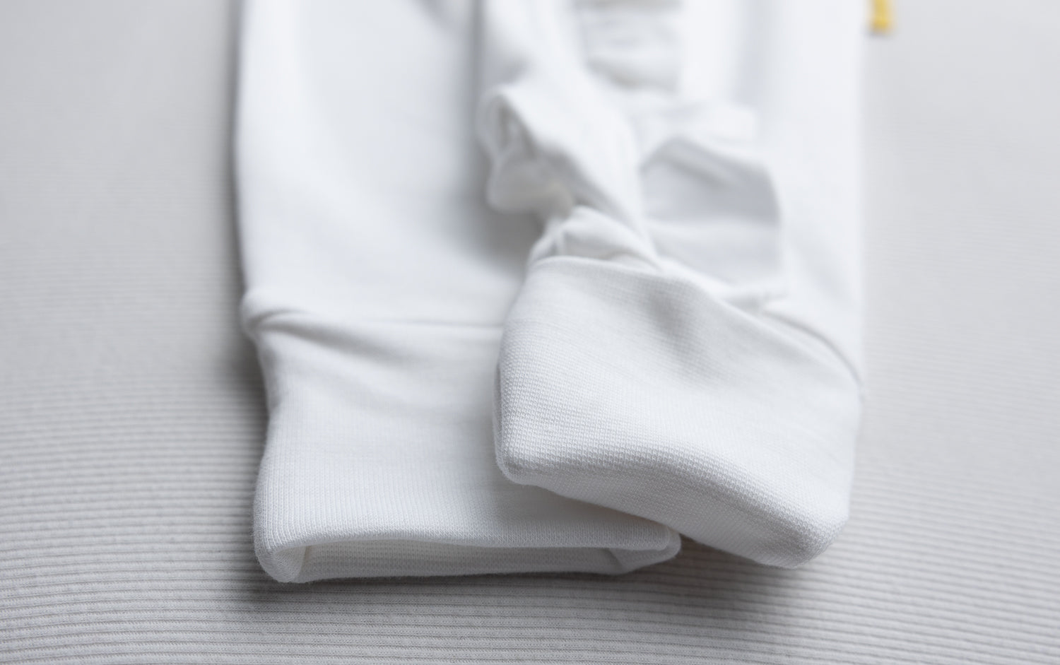 White ruffle organic cotton ZippyBoo suit