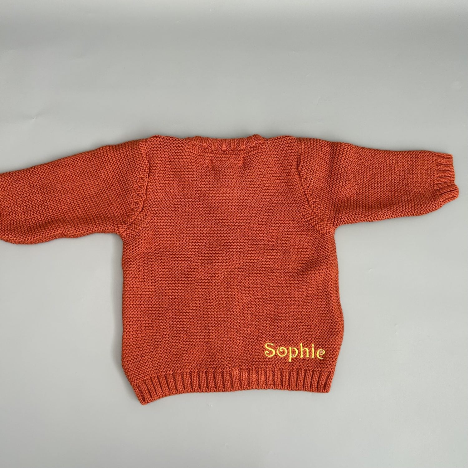 Rust organic cotton zipped cardigan