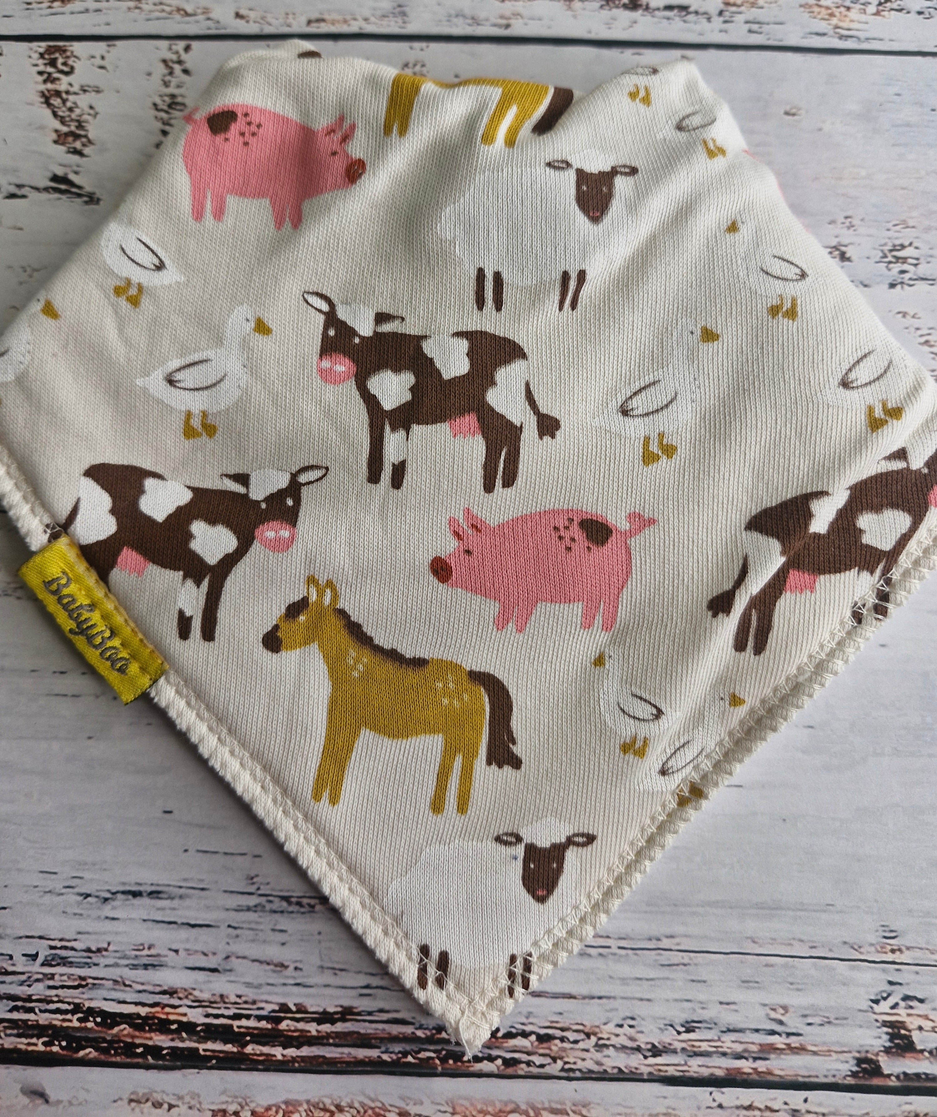 Barnyard Buddies cream organic cotton DribbleBoo bandana bib