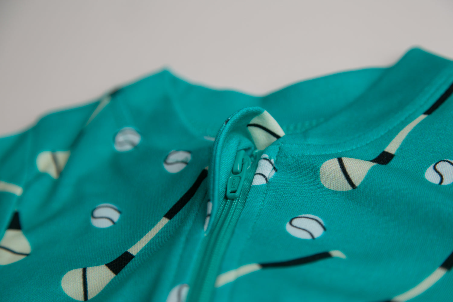 Teal GAA organic cotton ZippyBoo suit