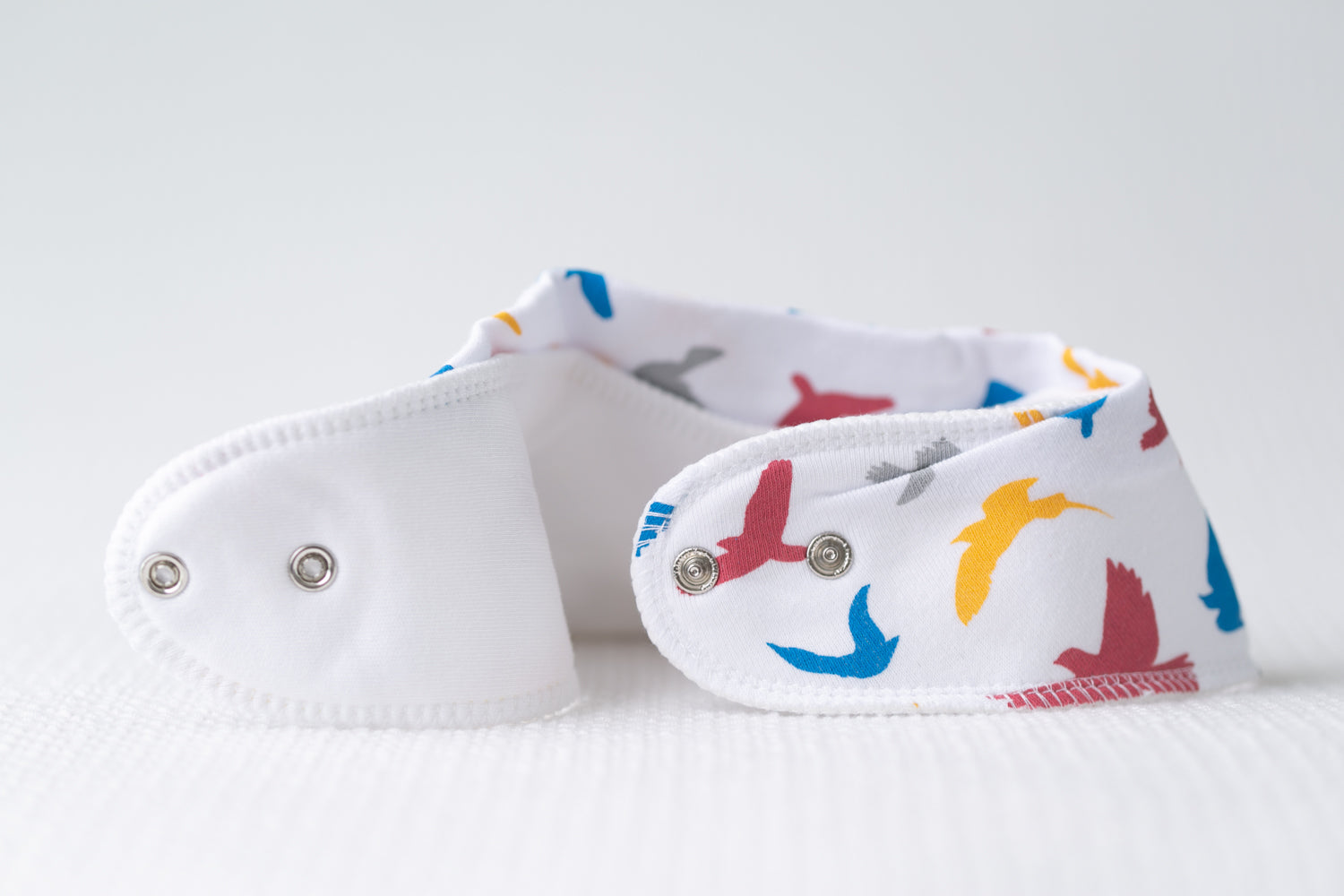 Colourful birds organic cotton DribbleBoo bandana bib