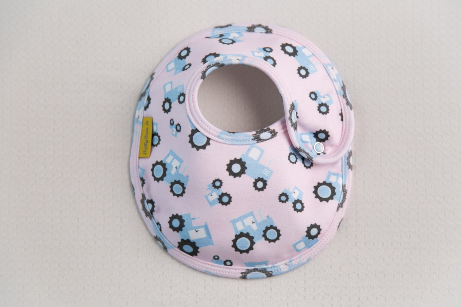 Pink with blue tractors organic cotton LittleBoo baby bib