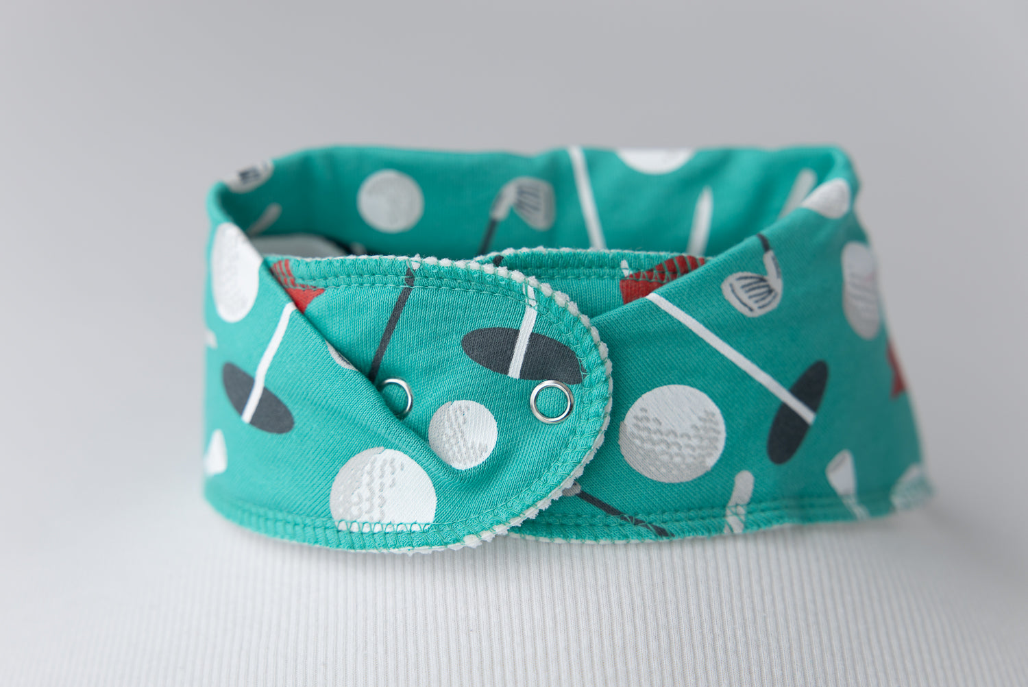 Teeing off organic cotton DribbleBoo bandana bib