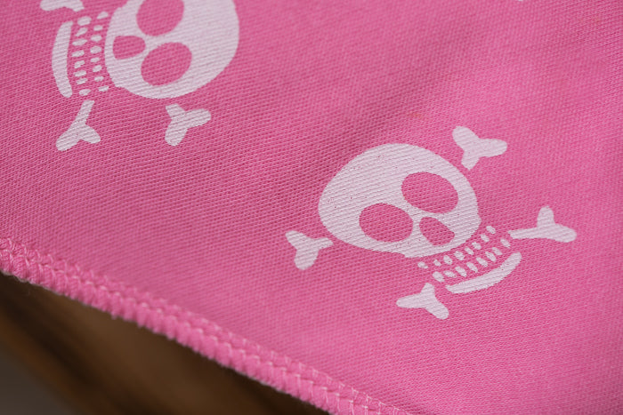 Skull and crossbone pink organic cotton DribbleBoo bandana bib