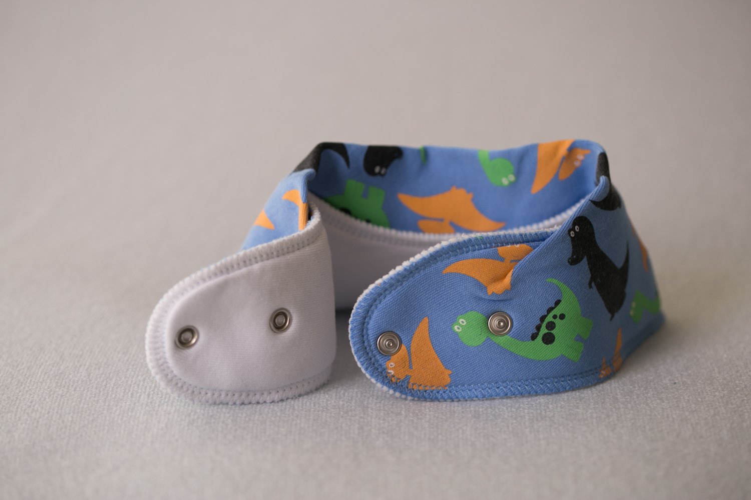 Blue dinos everywhere organic cotton DribbleBoo bandana bib