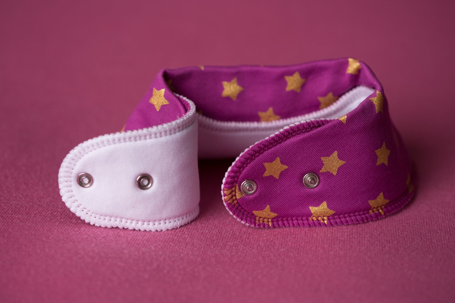 Plum with golden stars organic cotton DribbleBoo bandana bib