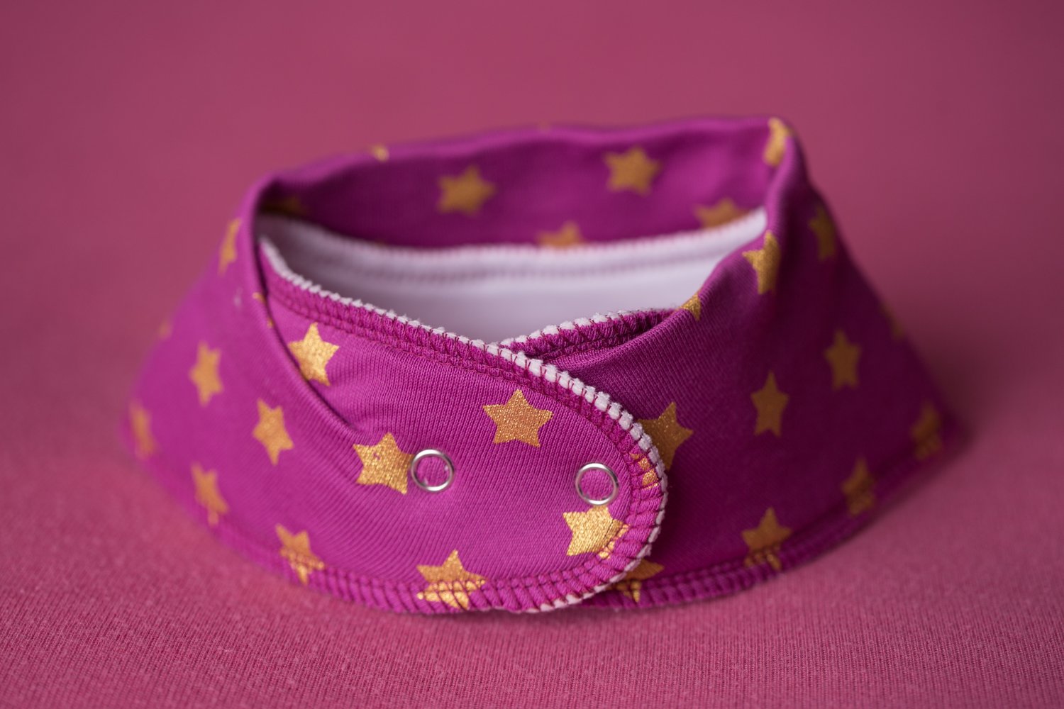 Plum with golden stars organic cotton DribbleBoo bandana bib
