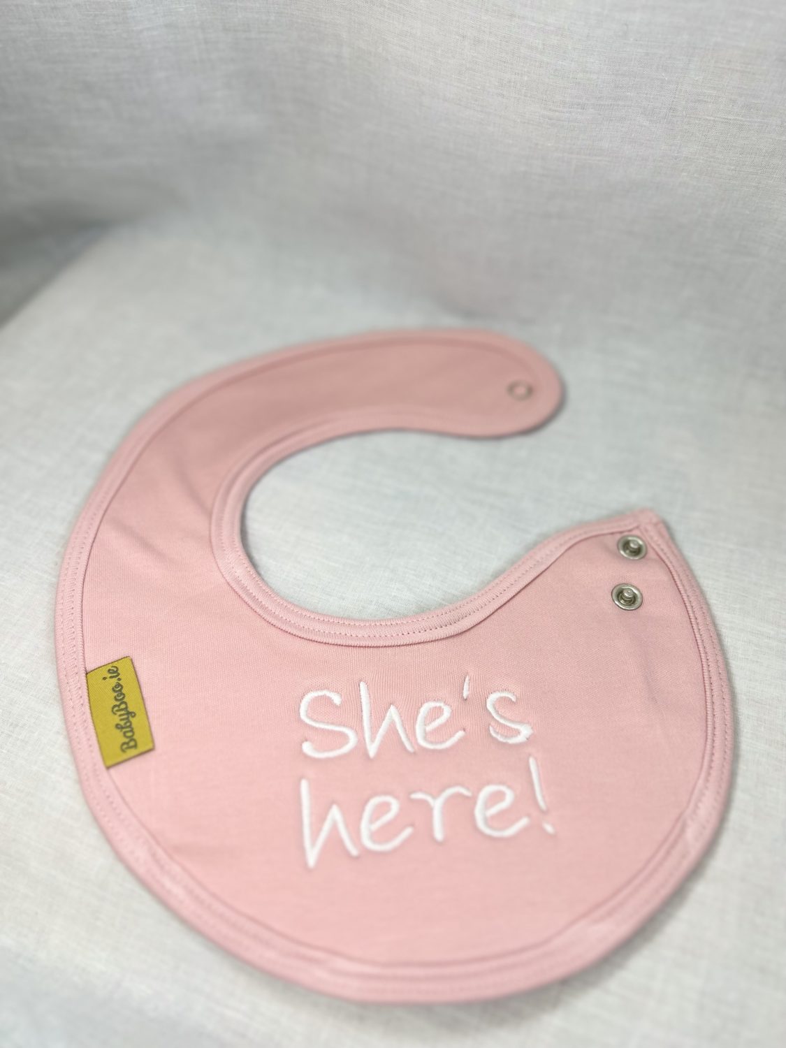 She's Here! organic cotton LittleBoo newborn bib