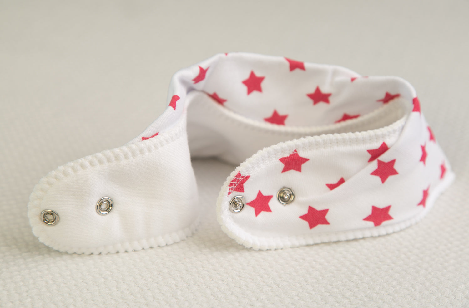 White with hot pink stars organic cotton DribbleBoo bandana bib