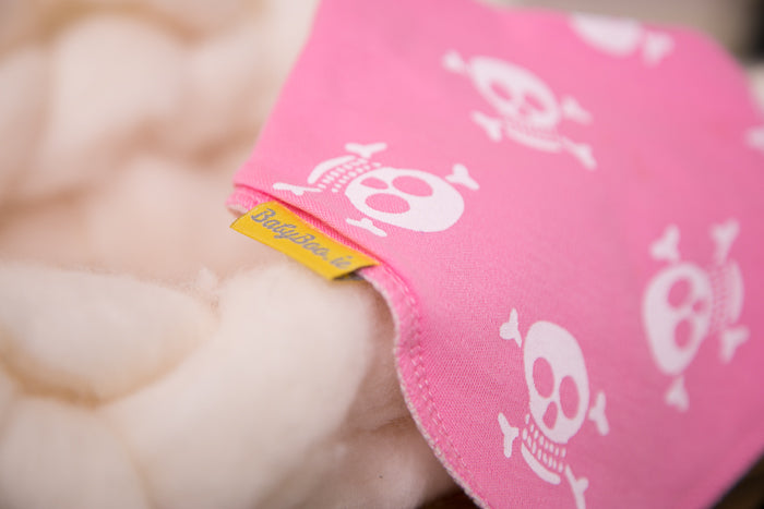 Skull and crossbone pink organic cotton DribbleBoo bandana bib