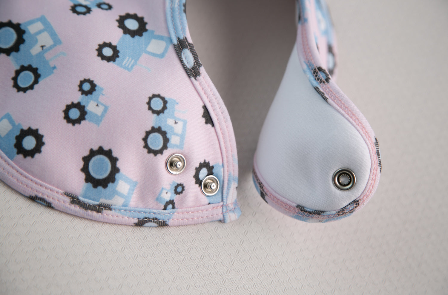 Pink with blue tractors organic cotton LittleBoo baby bib