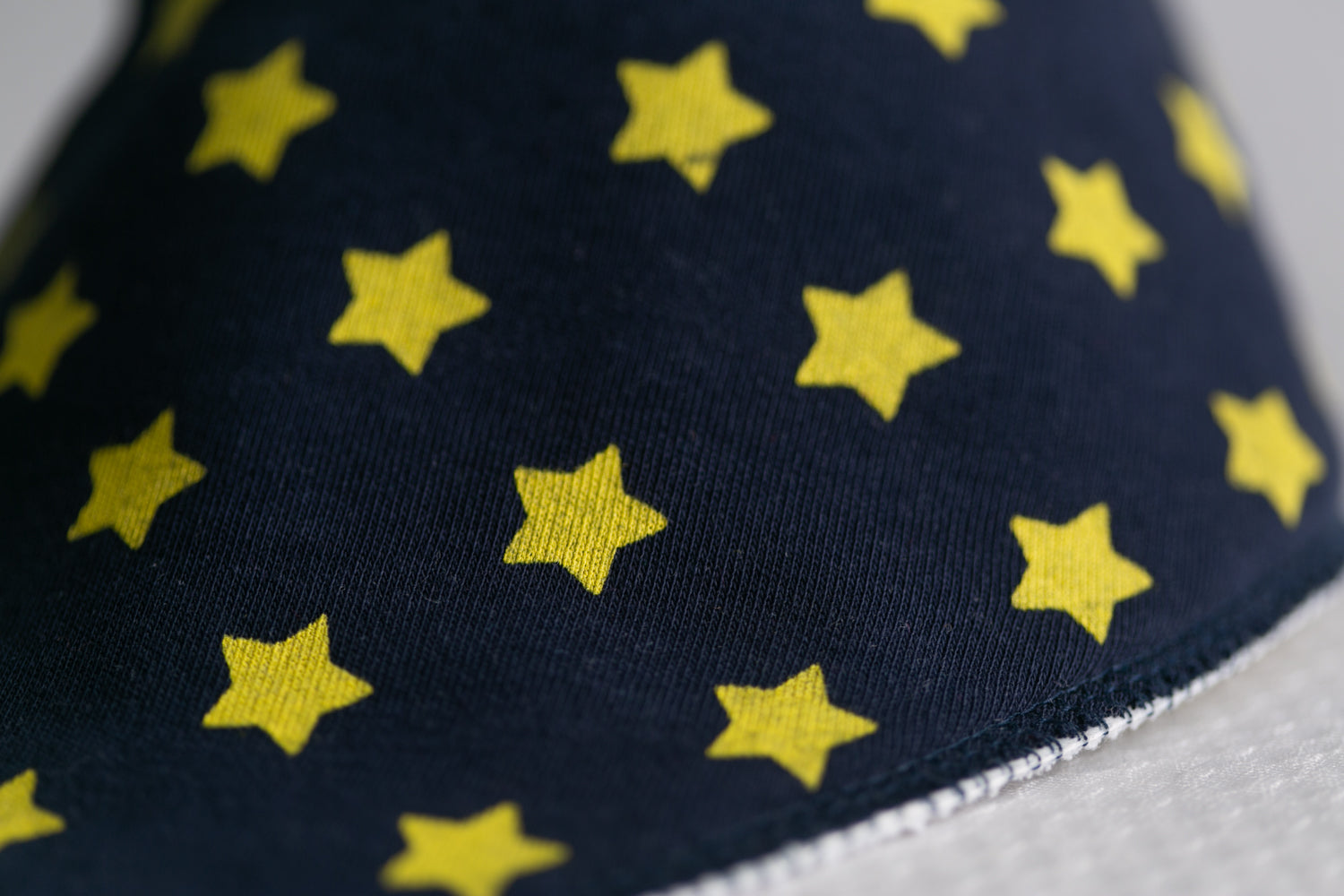 Navy with yellow stars organic cotton DribbleBoo bandana bib