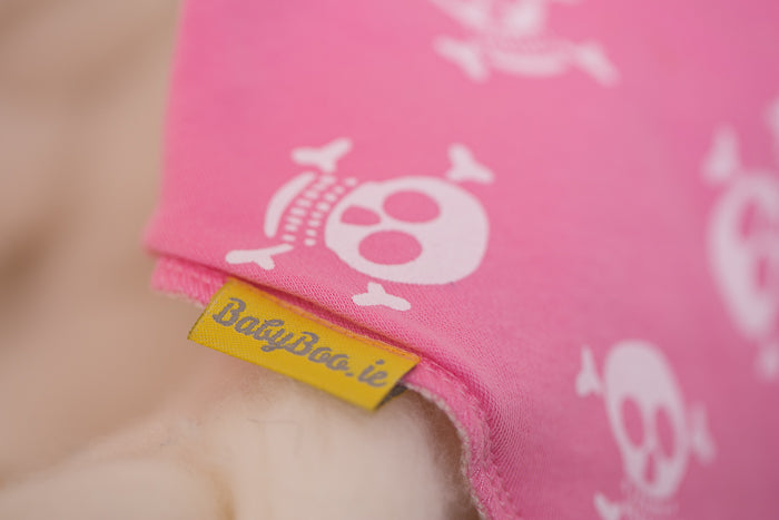Skull and crossbone pink organic cotton DribbleBoo bandana bib