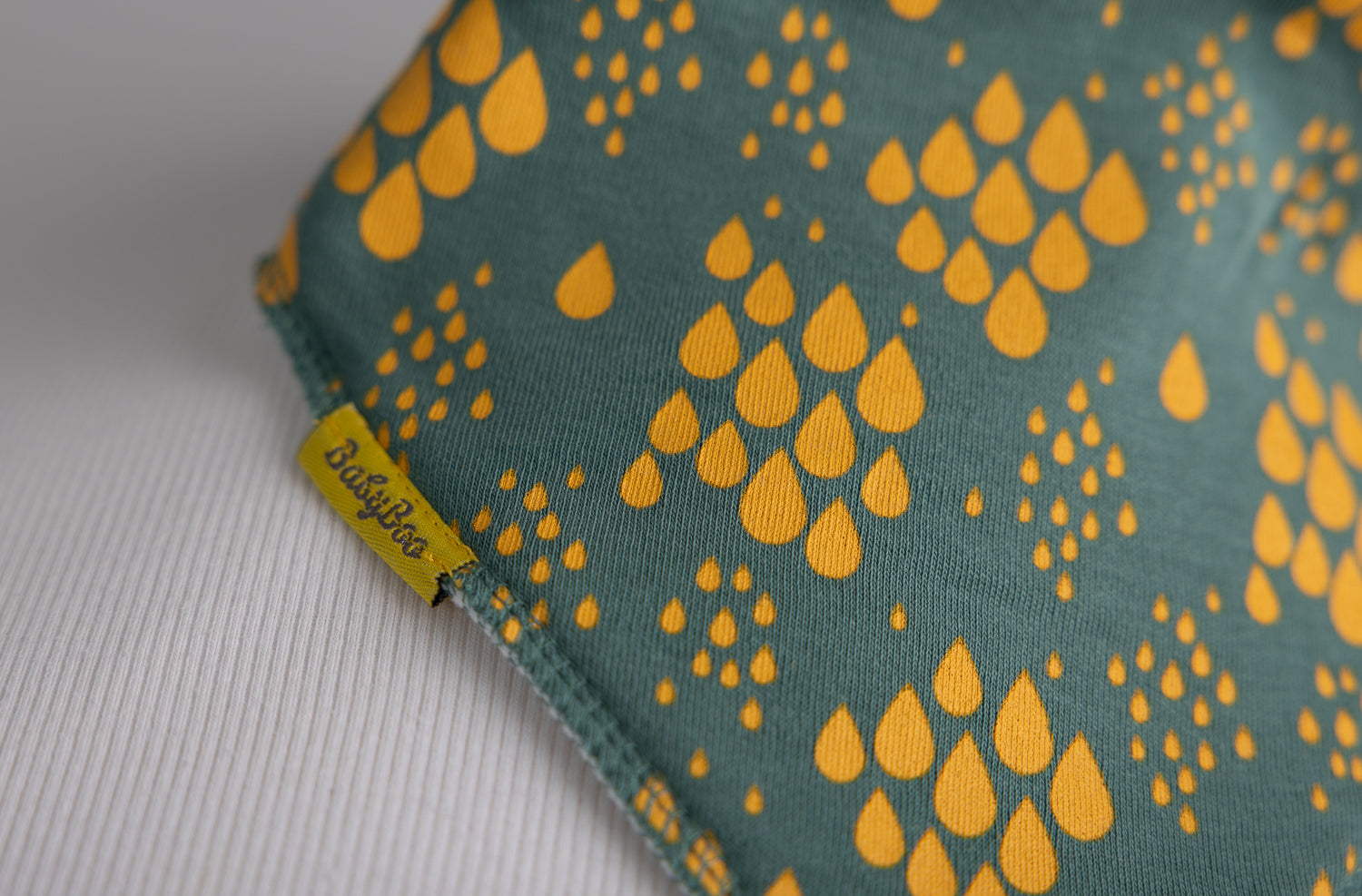 Teal with mustard raindrops organic cotton DribbleBoo bandana bib