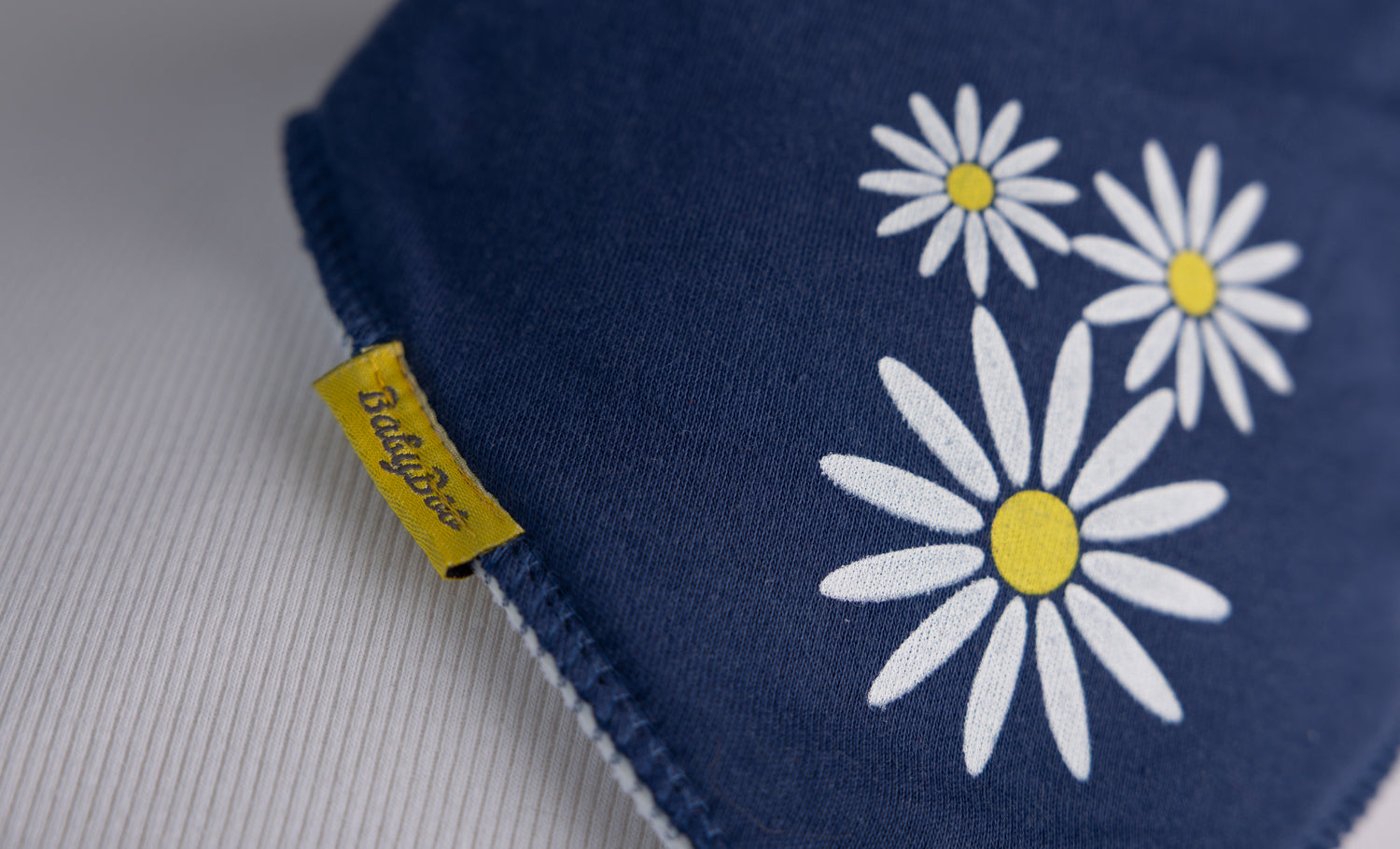 Navy daisy organic cotton DribbleBoo bandana bib