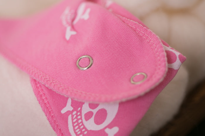 Skull and crossbone pink organic cotton DribbleBoo bandana bib
