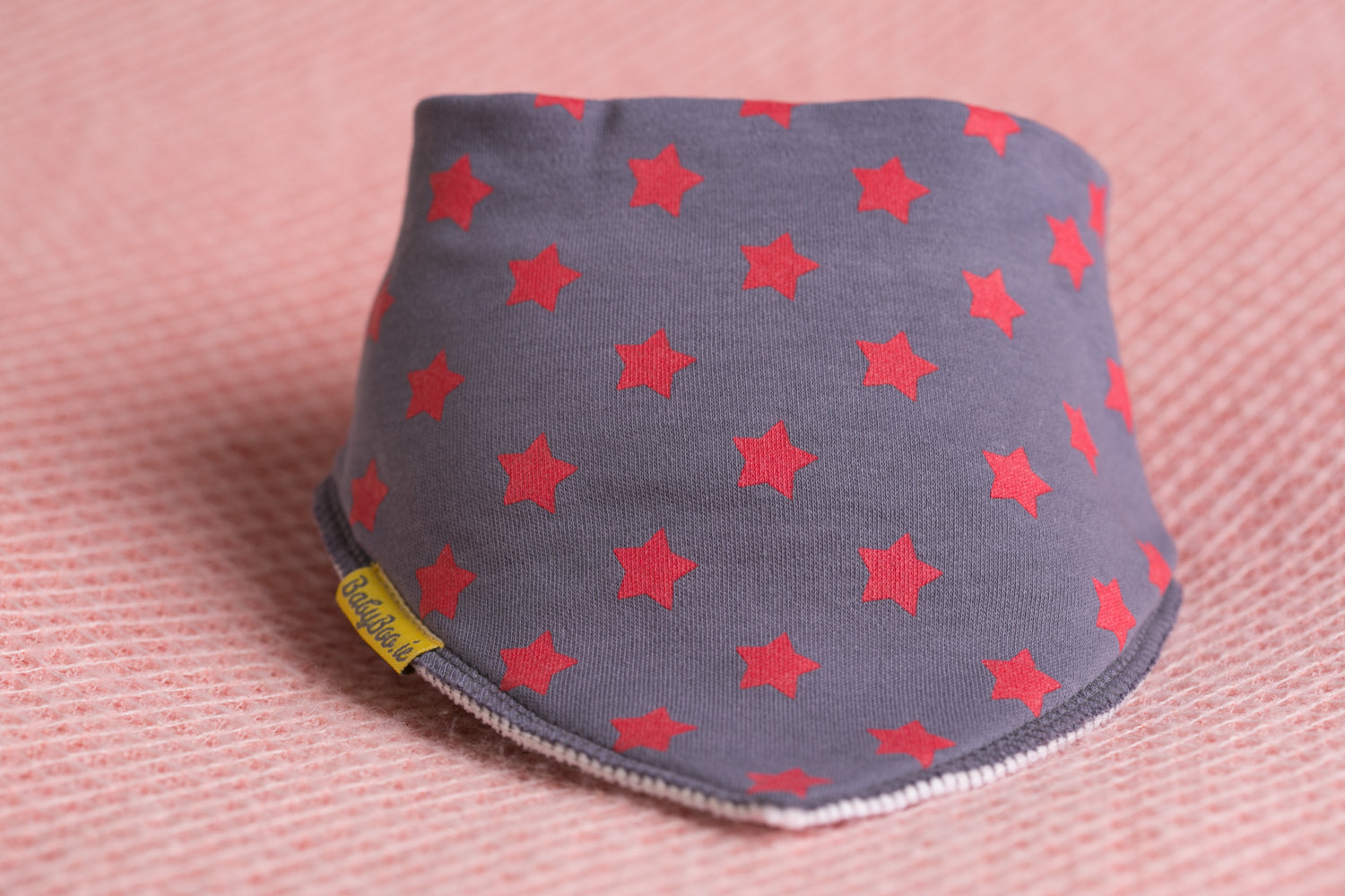 Red stars on grey organic cotton DribbleBoo bandana bib