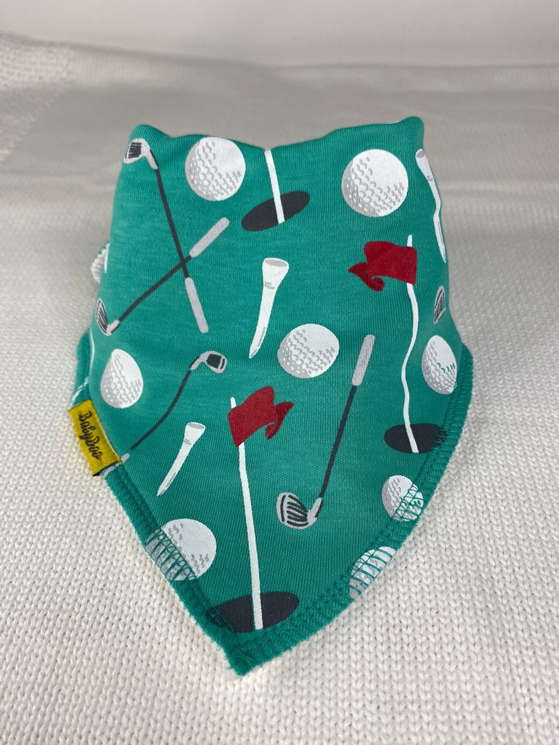 Teeing off organic cotton DribbleBoo bandana bib