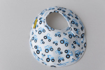 White and baby blue tractors organic cotton LittleBoo baby bib