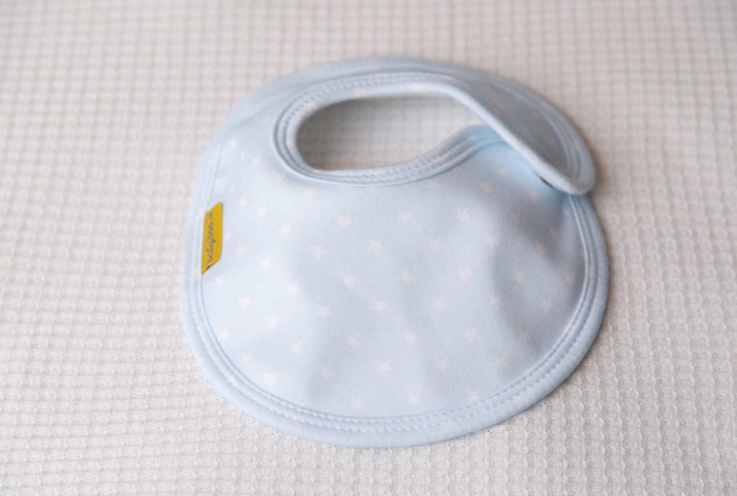 Baby blue with white stars organic cotton LittleBoo baby bib