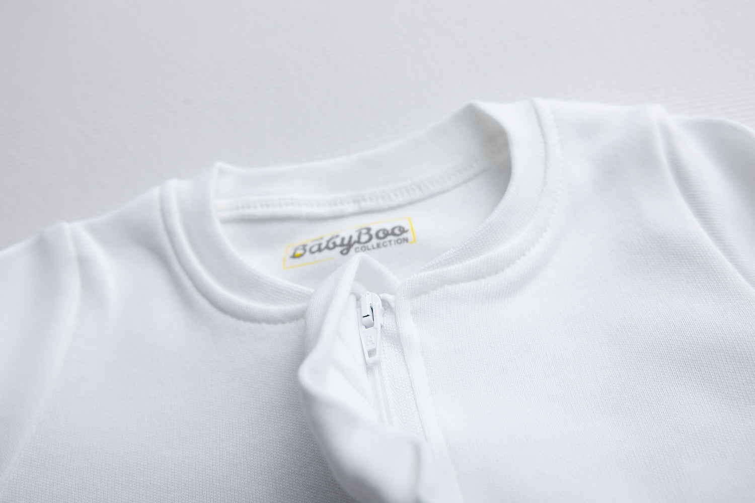 White ruffle organic cotton ZippyBoo suit