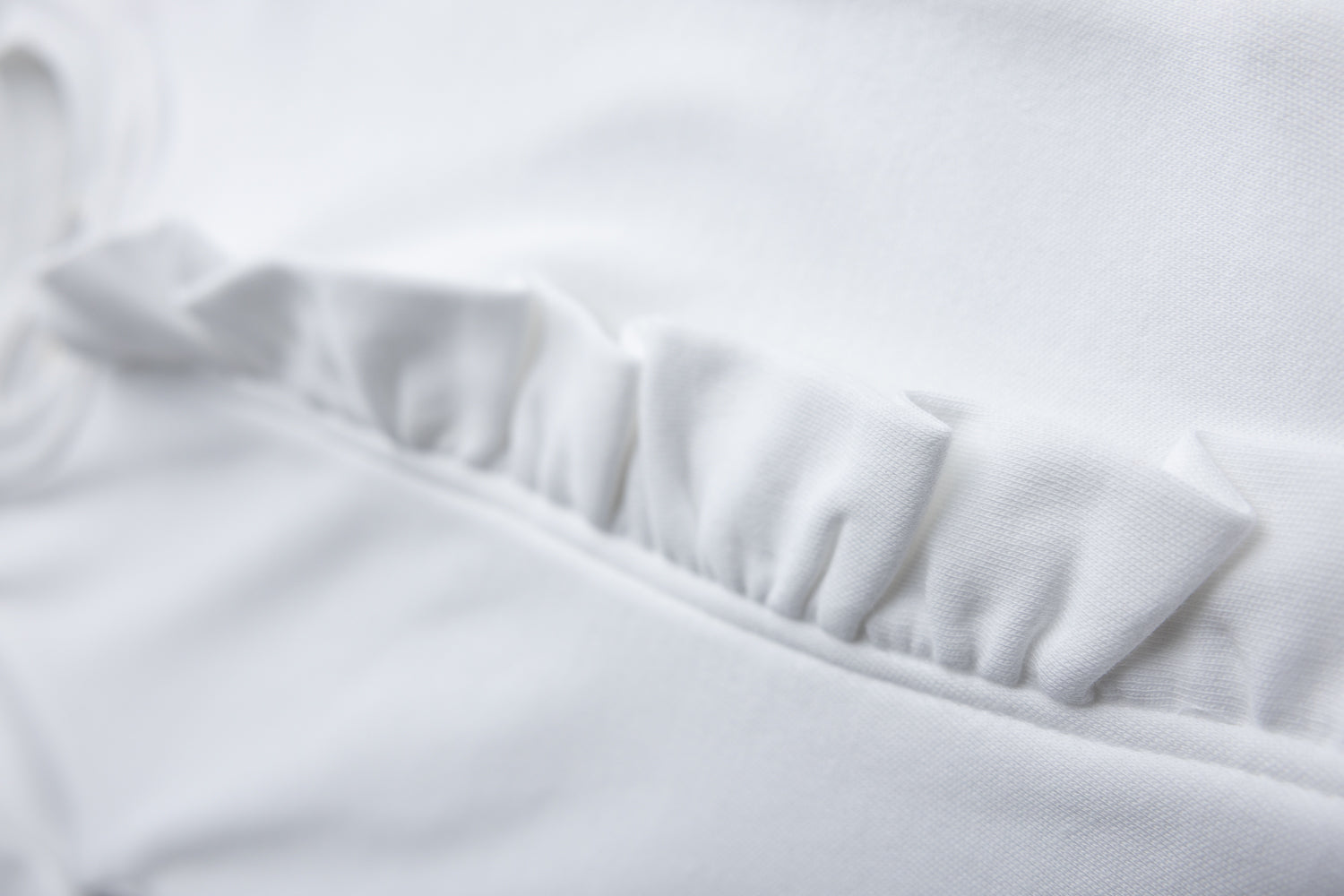 White ruffle organic cotton ZippyBoo suit