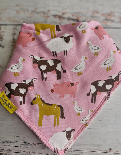 Barnyard Buddies pink organic cotton DribbleBoo bandana bib