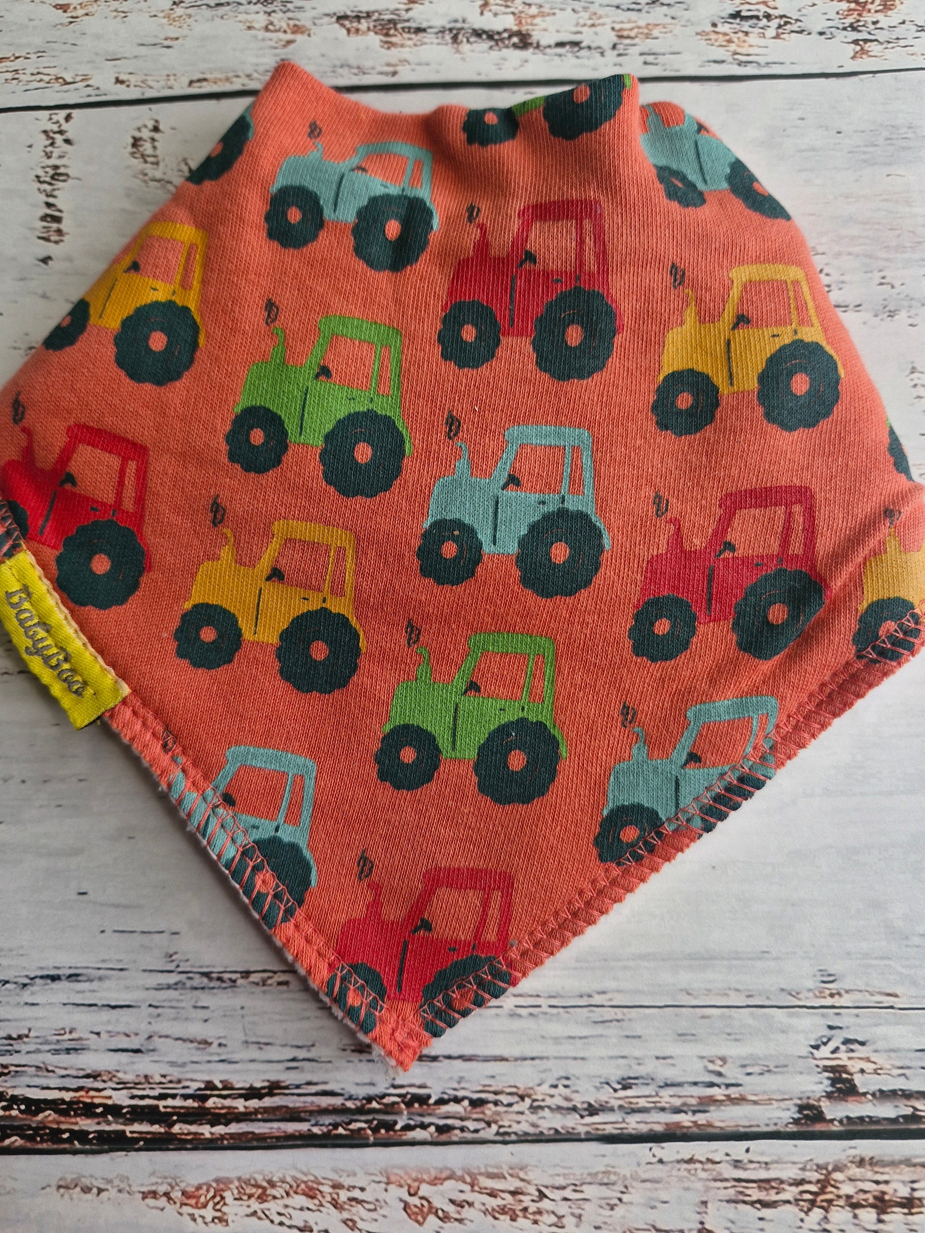 Tractor run orange organic cotton DribbleBoo bandana bib