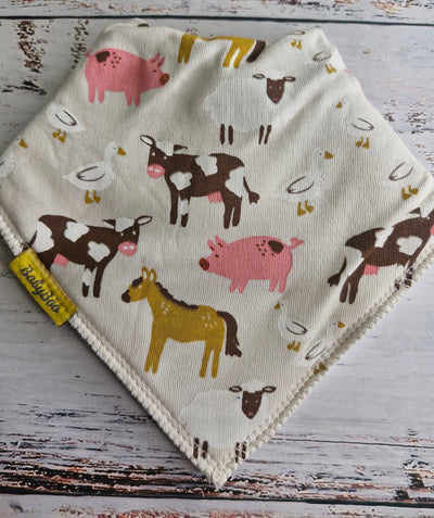 Barnyard Buddies cream organic cotton DribbleBoo bandana bib