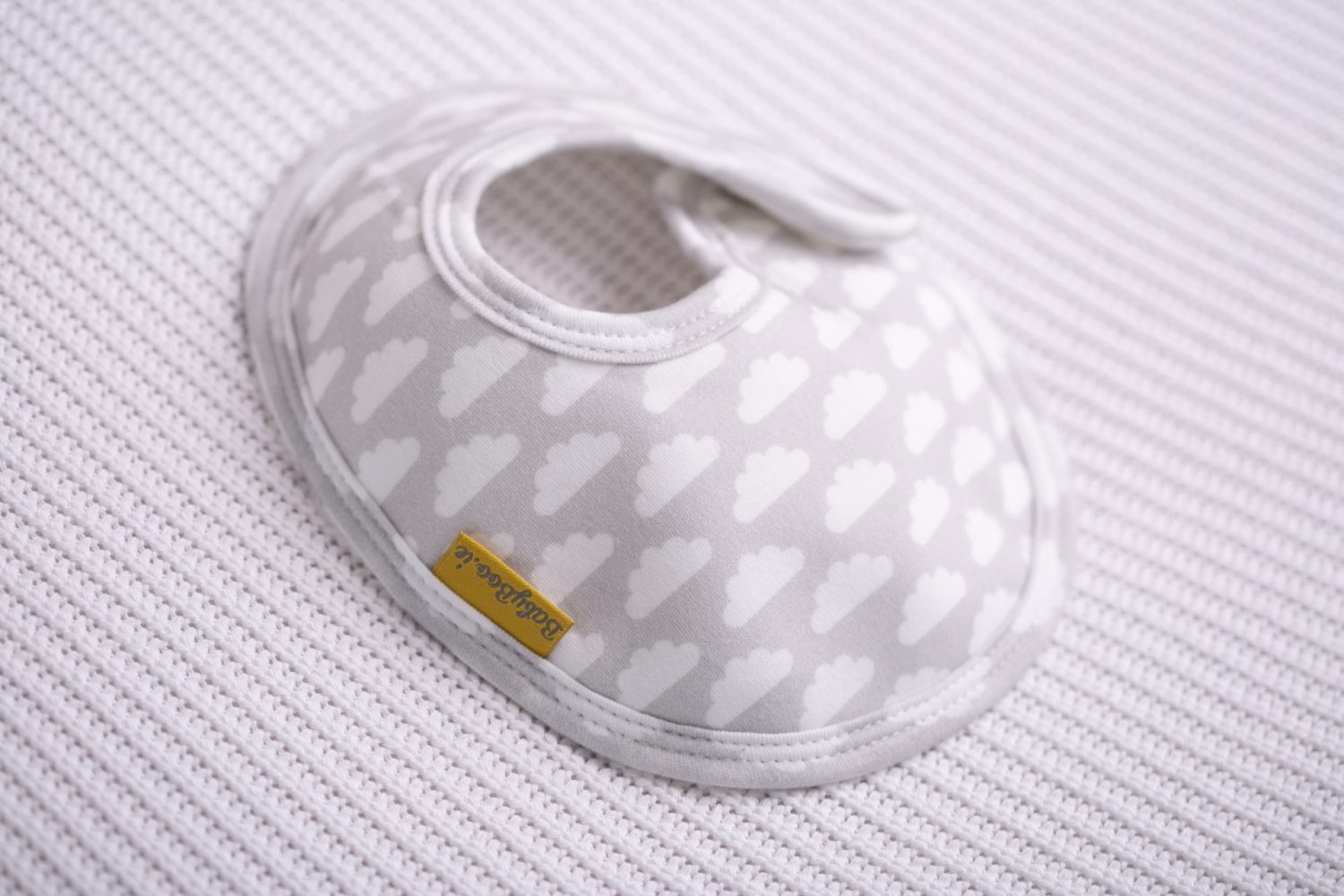 Grey with white clouds organic cotton LittleBoo baby bib