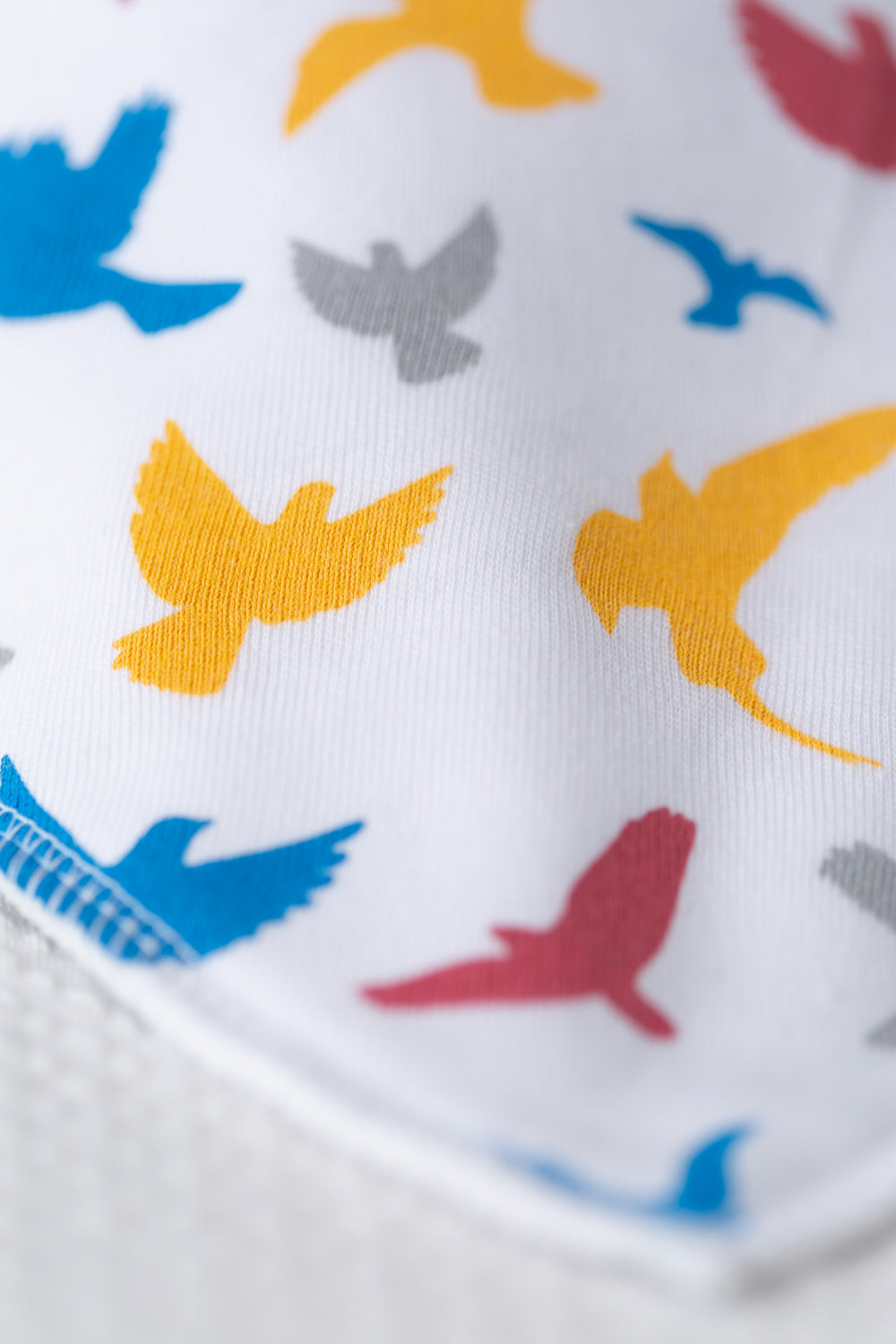Colourful birds organic cotton DribbleBoo bandana bib
