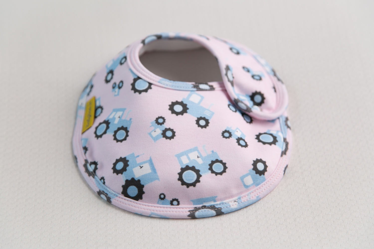 Pink with blue tractors organic cotton LittleBoo baby bib