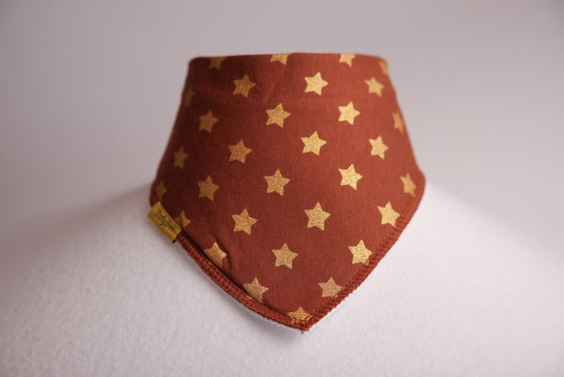 Gold stars on cocoa organic cotton DribbleBoo bandana bib