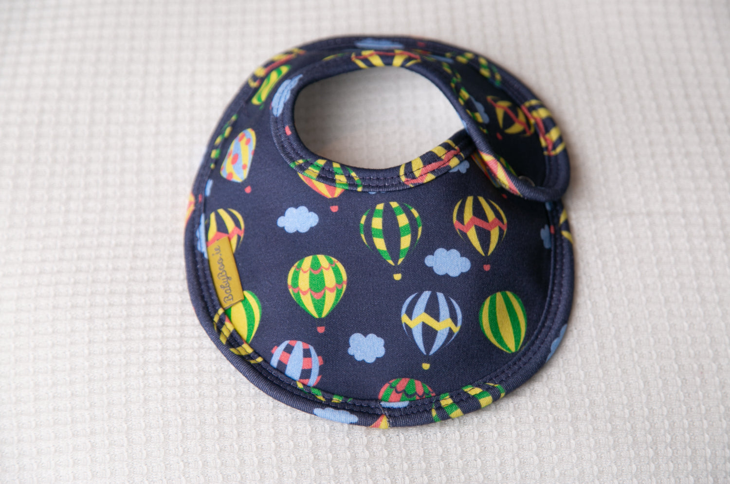Navy hot air balloons organic cotton LittleBoo baby bib