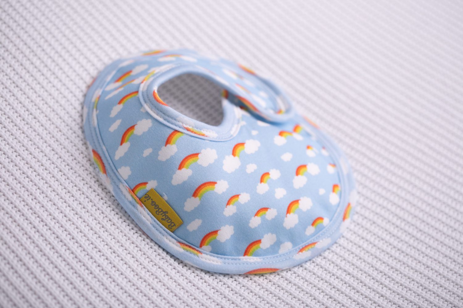 Rainbows and clouds organic cotton LittleBoo baby bib