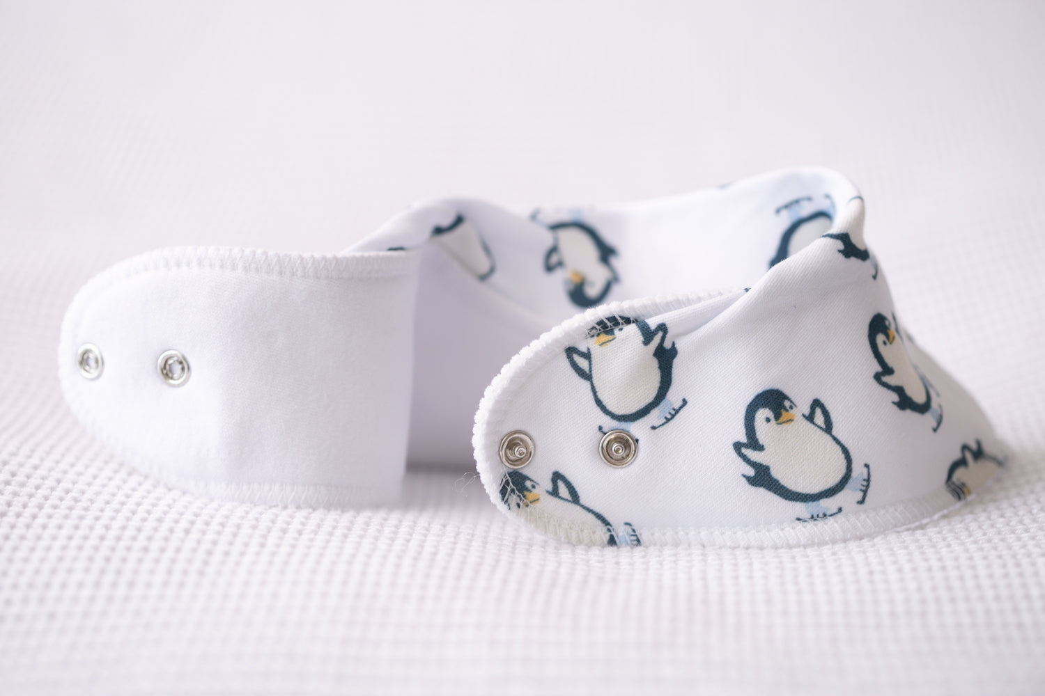 Skating penguins organic cotton DribbleBoo bandana bib