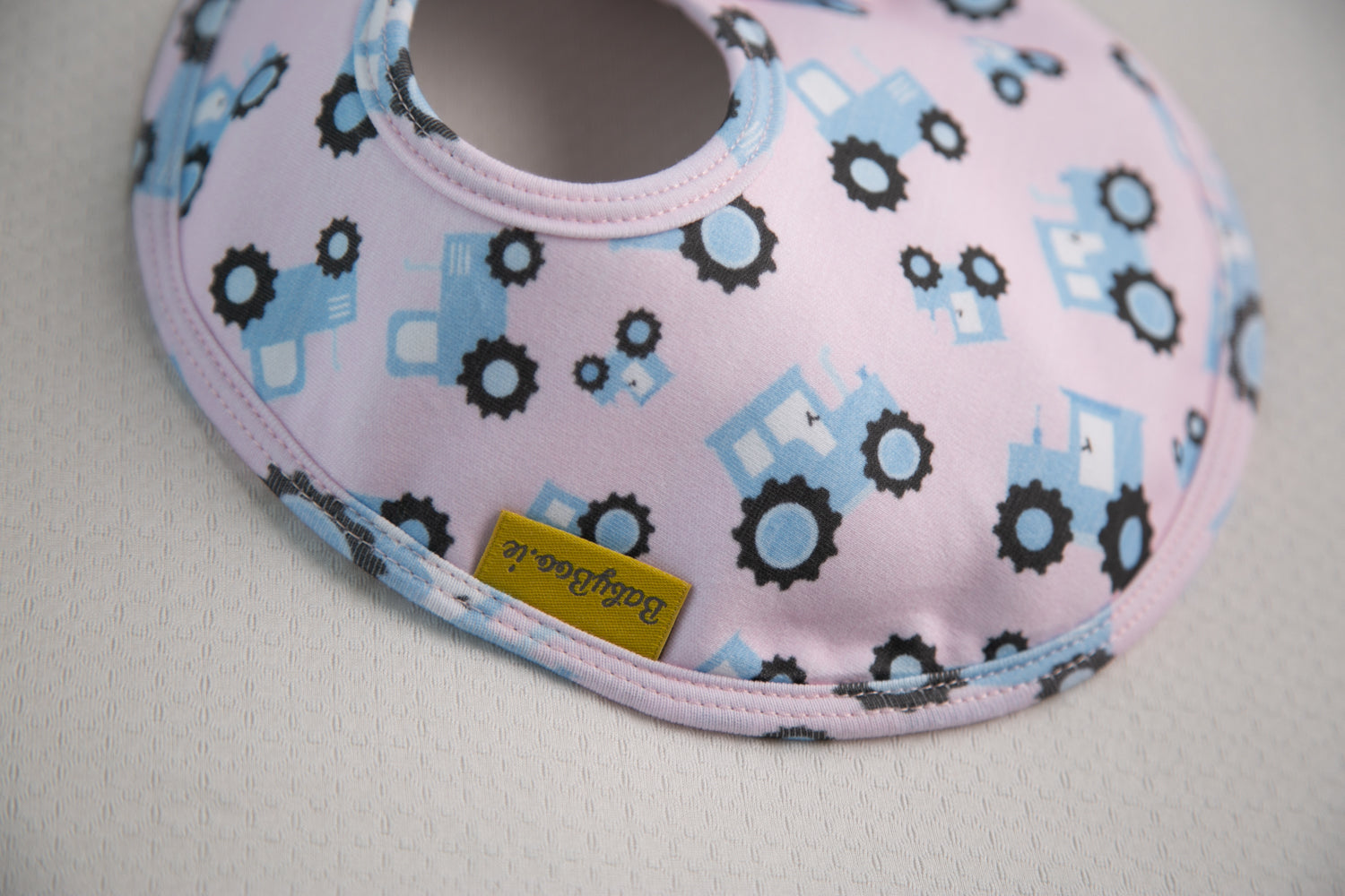 Pink with blue tractors organic cotton LittleBoo baby bib