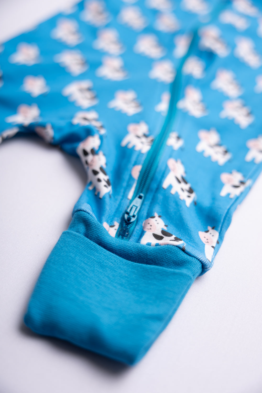 Blue Bessie Cow organic cotton ZippyBoo suit