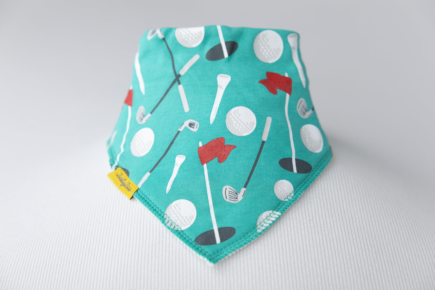Teeing off organic cotton DribbleBoo bandana bib