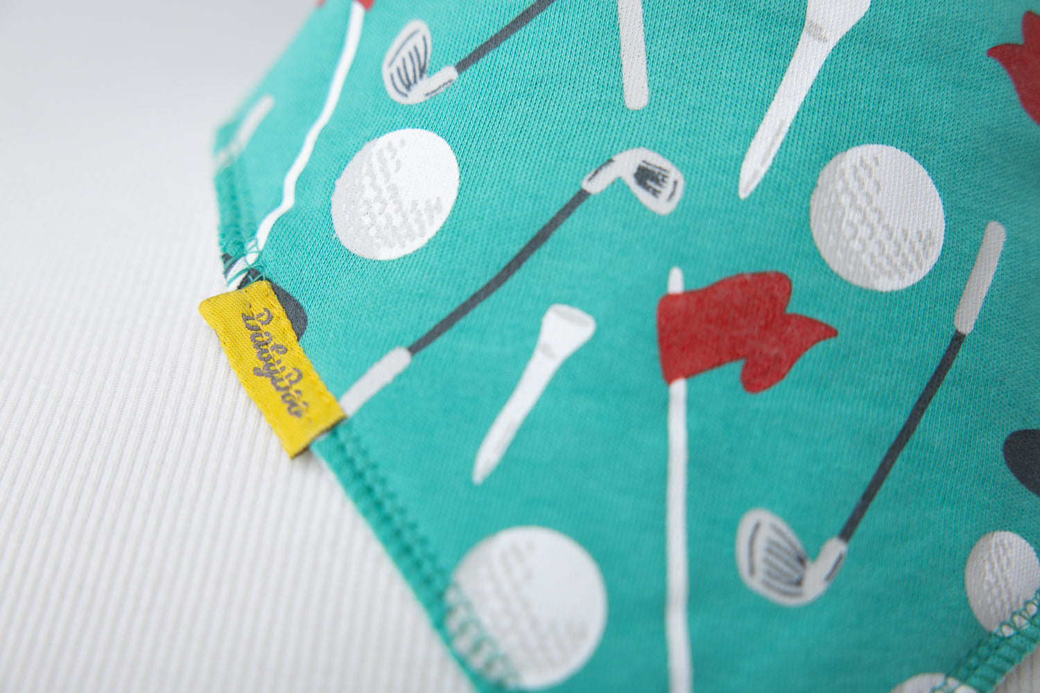 Teeing off organic cotton DribbleBoo bandana bib