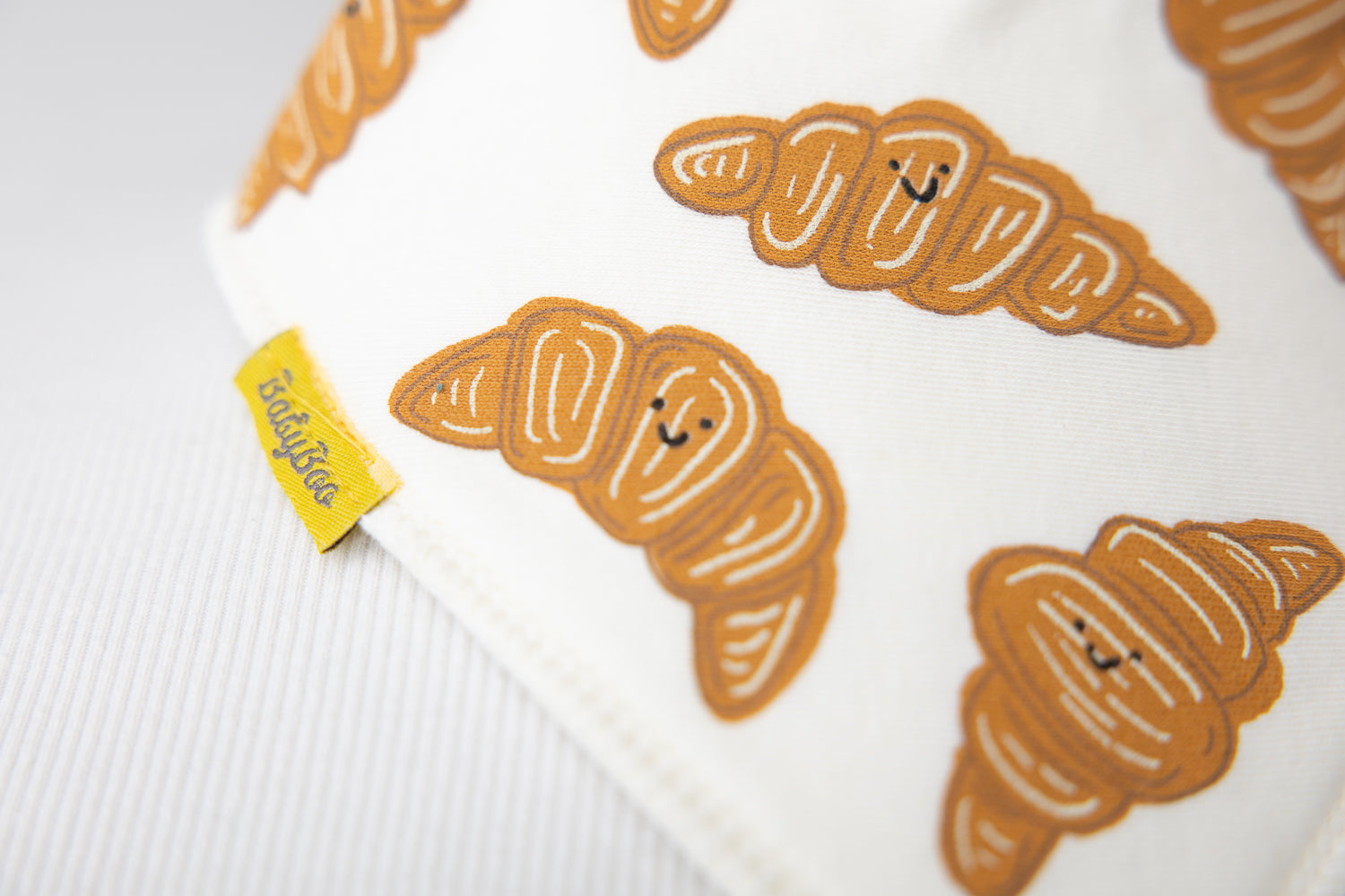 Le Petit Croissant cream organic cotton DribbleBoo bandana bib