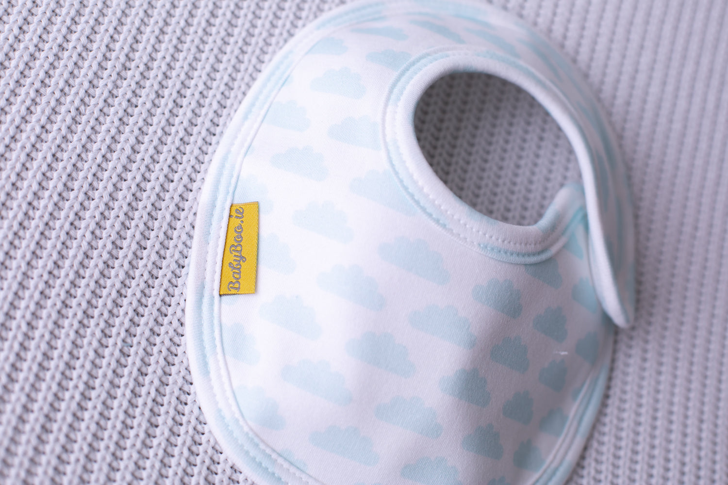 White with blue clouds organic cotton LittleBoo baby bib