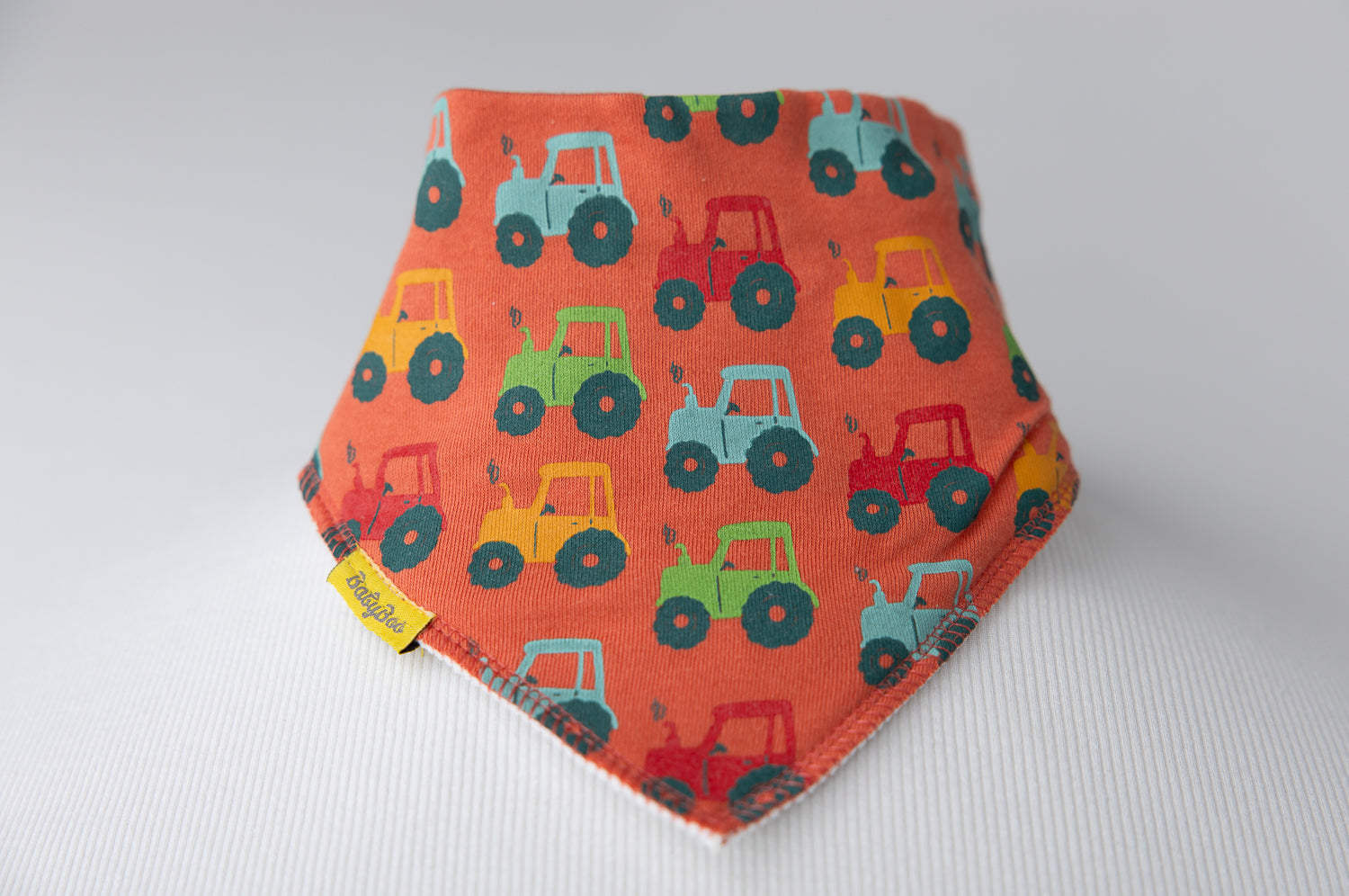 Tractor run orange organic cotton DribbleBoo bandana bib