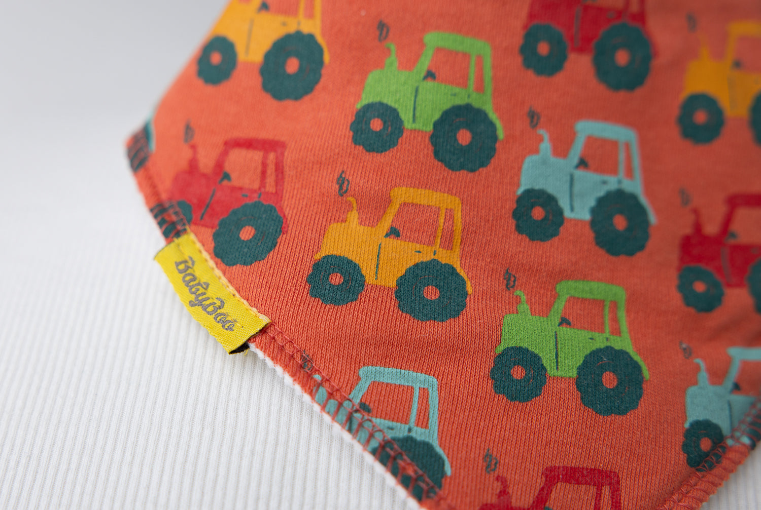 Tractor run orange organic cotton DribbleBoo bandana bib