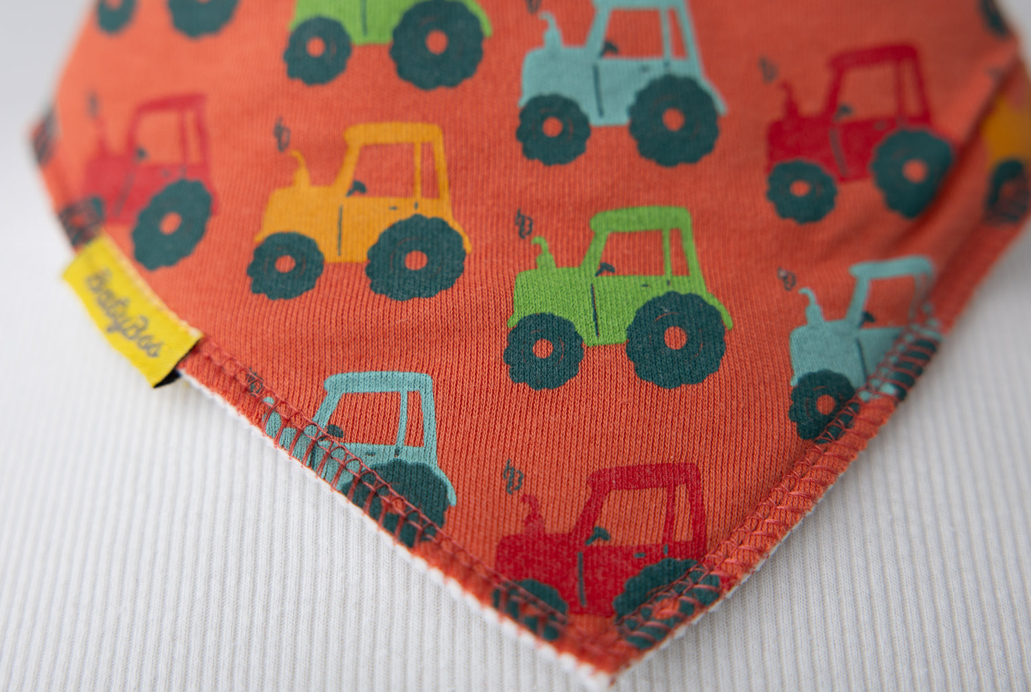 Tractor run orange organic cotton DribbleBoo bandana bib