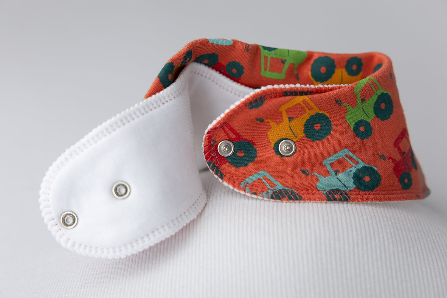 Tractor run orange organic cotton DribbleBoo bandana bib
